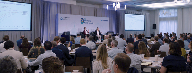audience watching panelists new home trends summit